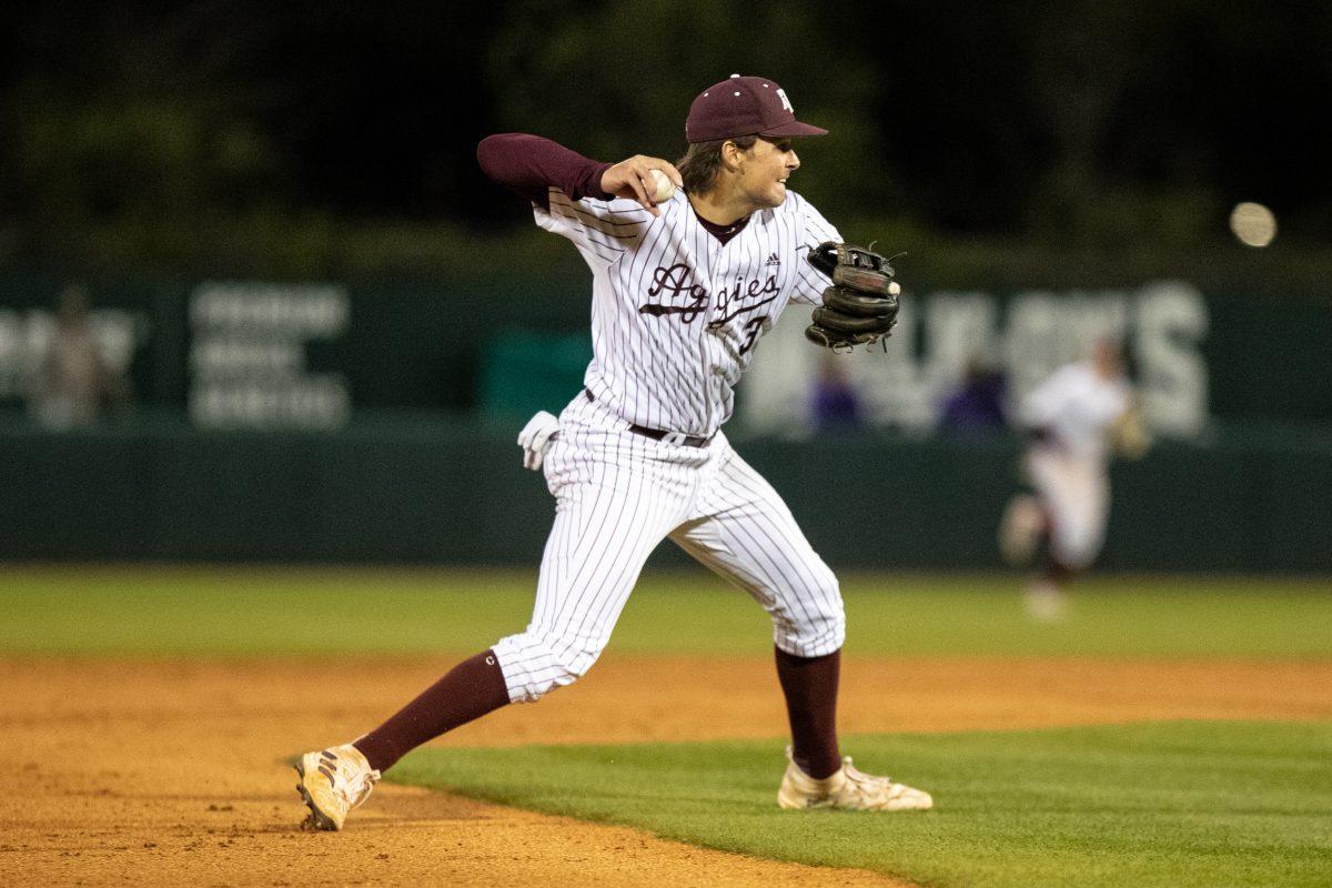 Freshman INF Kaeden Kent (3) gets ready to throw the baseball to first base for an out at Olsen Field on Friday, March 17, 2023.