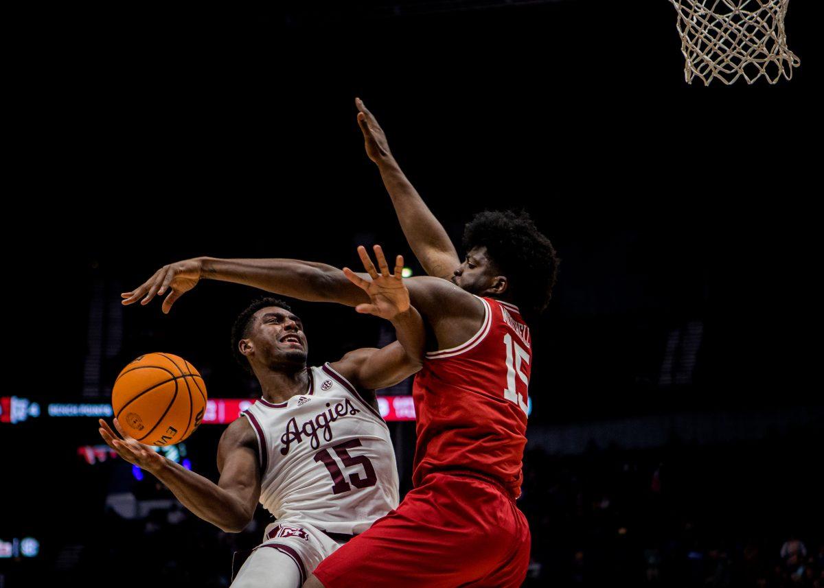 Junior F Henry Coleman (15) shoots a layup during the game vs. Arkansas on Friday, March 10, 2023 at Bridgestone Arena in Nashville, Tennessee.