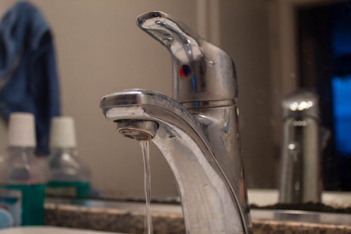 <p>A water faucet drips at Park West apartments on March 5th, 2023.</p>