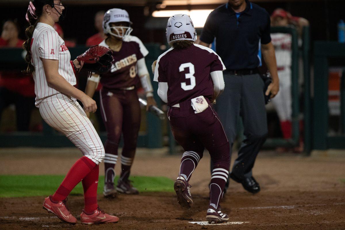 Sophomore Koko Wooley (3) touches home plate at Davis Diamond on Wednesday, March. 1, 2023