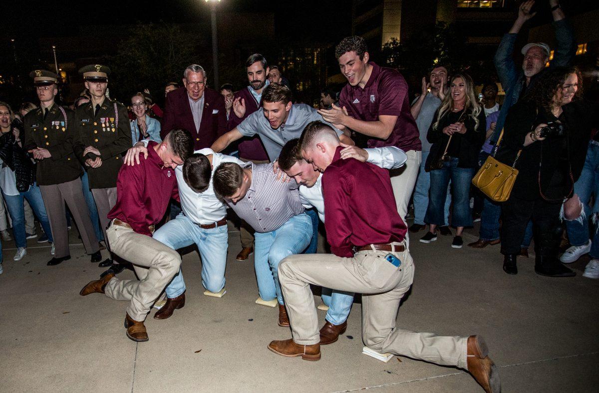 Previous yell leaders cheer on as 5 for Yell get called out at the winners for the 2023 election at the 12th man statue on Friday, March 3, 2023.