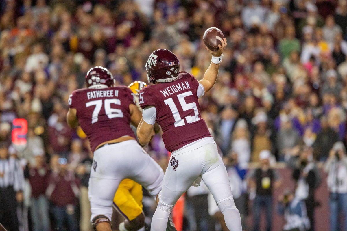 Freshman QB Conner Weigman (15) throws a pass during A&amp;M's game vs. LSU at Kyle Field on Saturday, Nov. 26, 2022. (Jonathan Taffet/The Battalion)