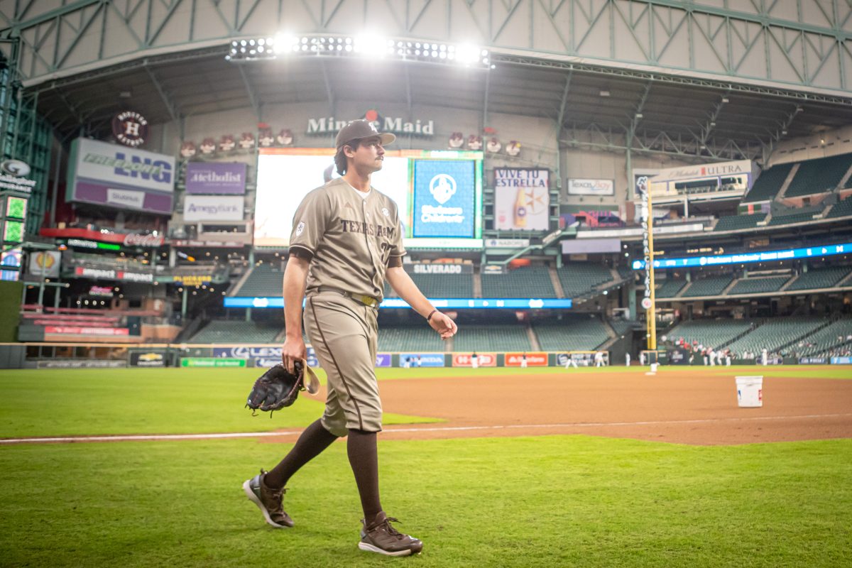 Senior RHP Carson Lambert (27) walks to the dugout before the start of Texas A&amp;M's game against Texas Tech at Minute Maid Park in Houston, Texas, on Sunday, March 5, 2023.