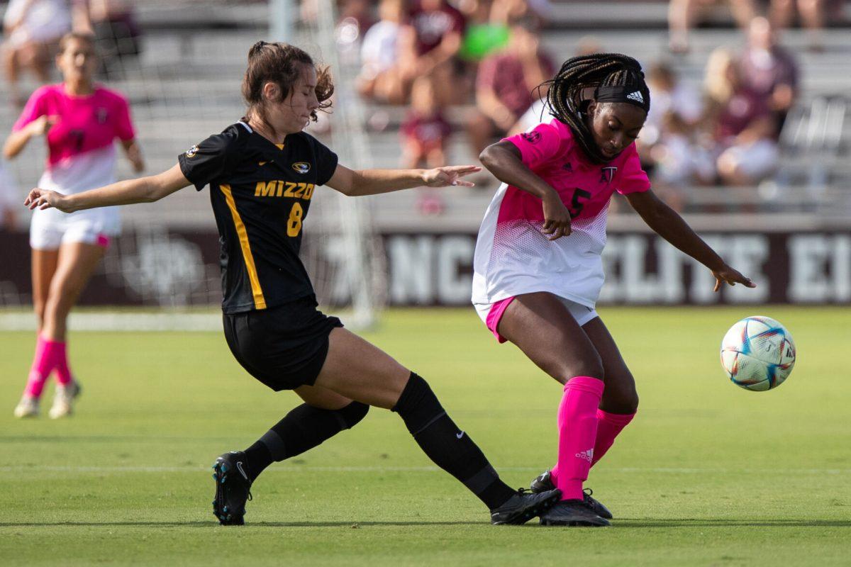 <p>Sophomore F Makhiya McDonald (5) fights for the ball against Mizzou's Rachel Kutella (8) during A&M's match against Mizzou at Ellis Field on Sunday, Oct. 23, 2022.</p>