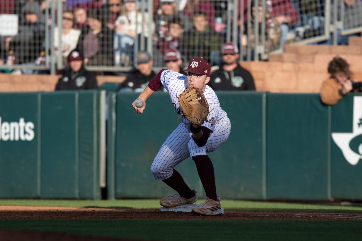 Junior INF Jack Moss (9) focuses on catching the baseball to get an out at Olsen Field on Friday, March 17, 2023.