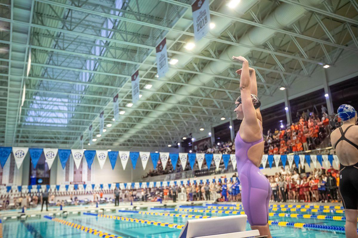 Senior Giulia Goerigk lines up behind the block before the start of the Women's 400 Yard IM during the 2023 SEC Swimming &amp; Diving Championships at the Rec Center Natatorium on Wednesday, Feb. 16, 2022.