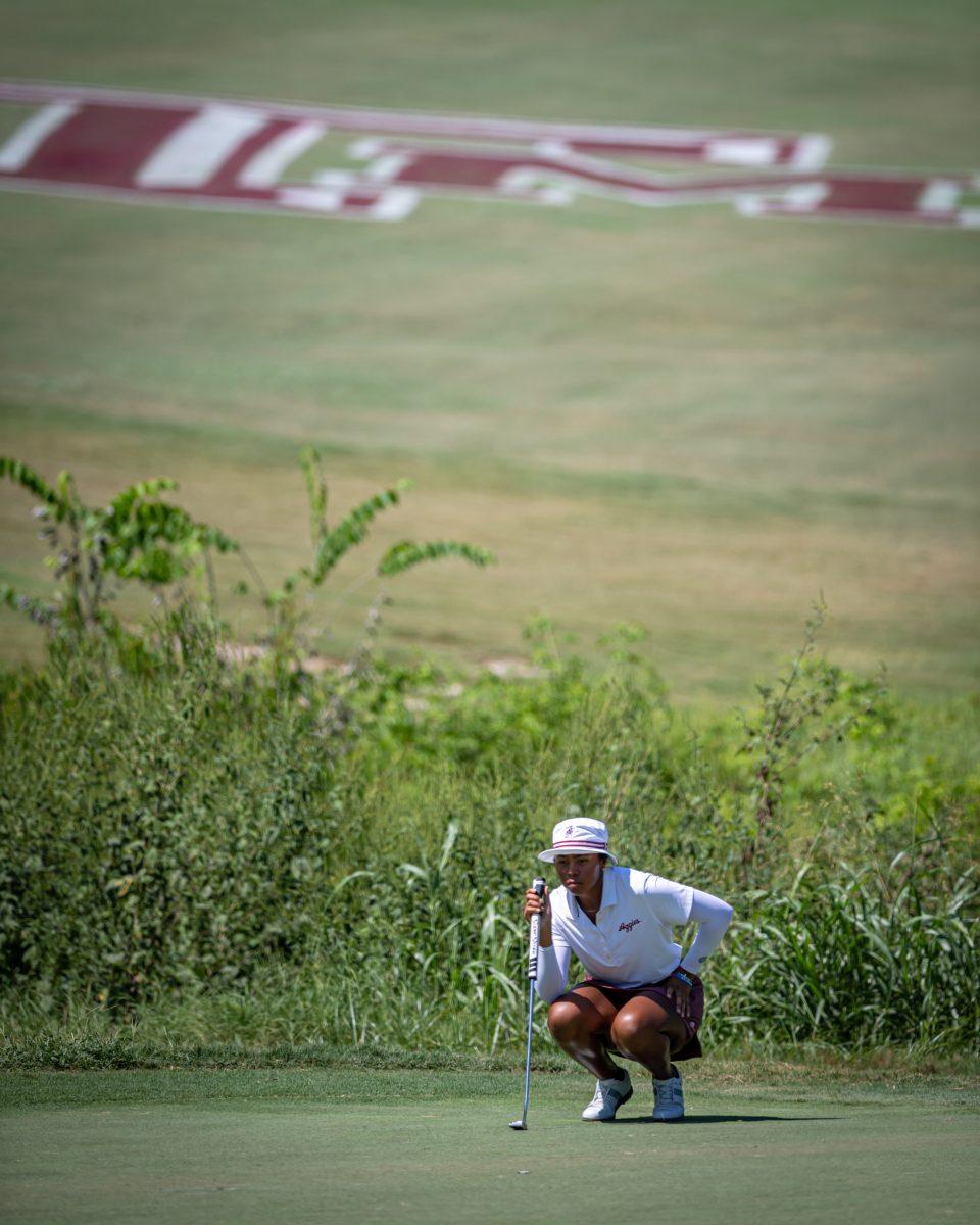 Junior Zoe Slaughter lines up her putt on the green of the 18th hole of the Traditions Club on the second day of the Momorial Invitational on Wednesday, Sept. 21, 2022 in Bryan, Texas.