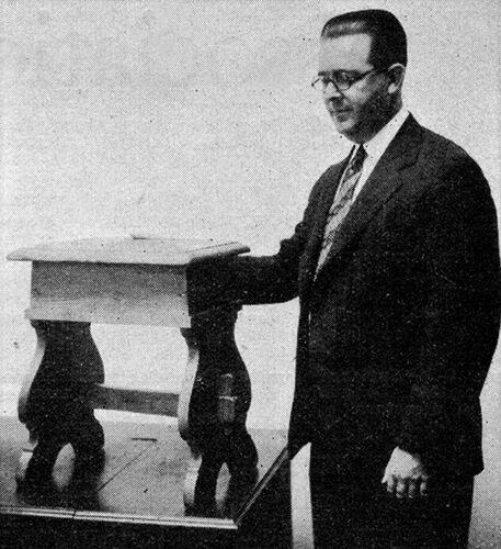 <p>H.C Barnes, secretary manager of the Southern Pine Association, next to the box being donated in 1929.</p>