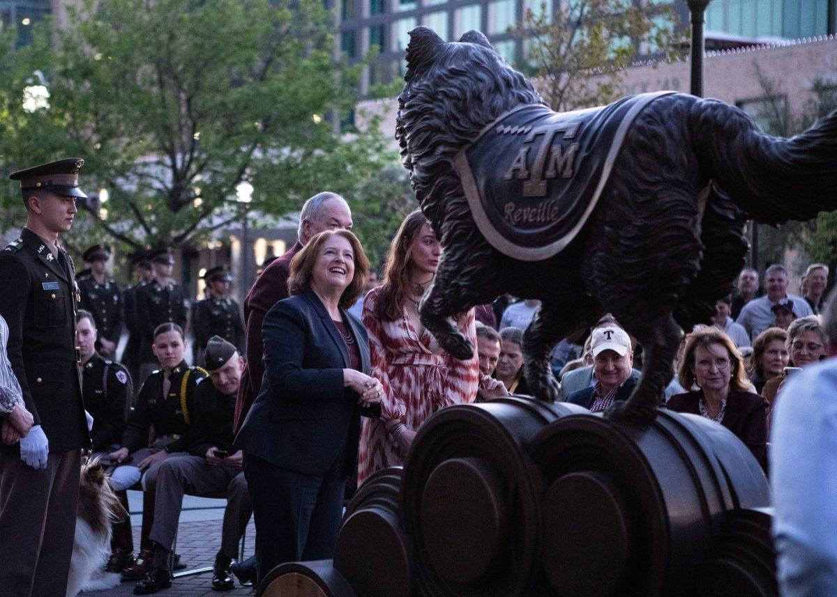 <p>President M Kathy Banks looks at the Reveille statue during the unveiling on Friday, March 3, 2023.</p>