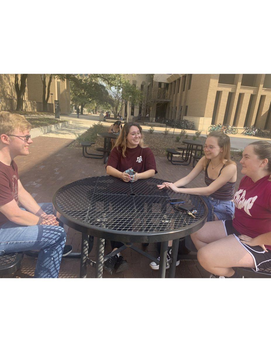 Sophomores Philip Hulzing, Emily Russell, and Julia Taylor, gather to talk about the day by Evans Library on Thursday, Feb. 23, 2023.