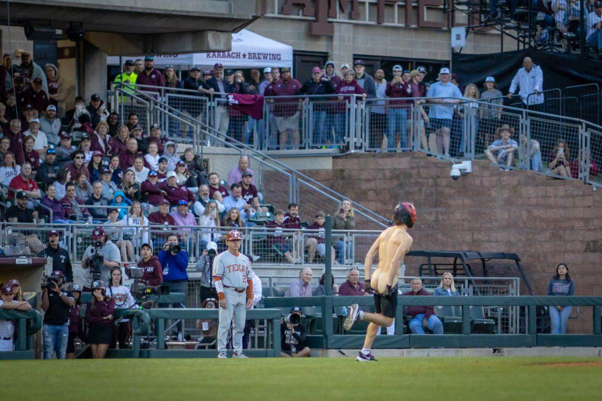 A streaker wearing a Darth Maul mask exposes himself on the field during Texas A&amp;M's game against Texas at Olsen Field on Tuesday, March 28, 2023.