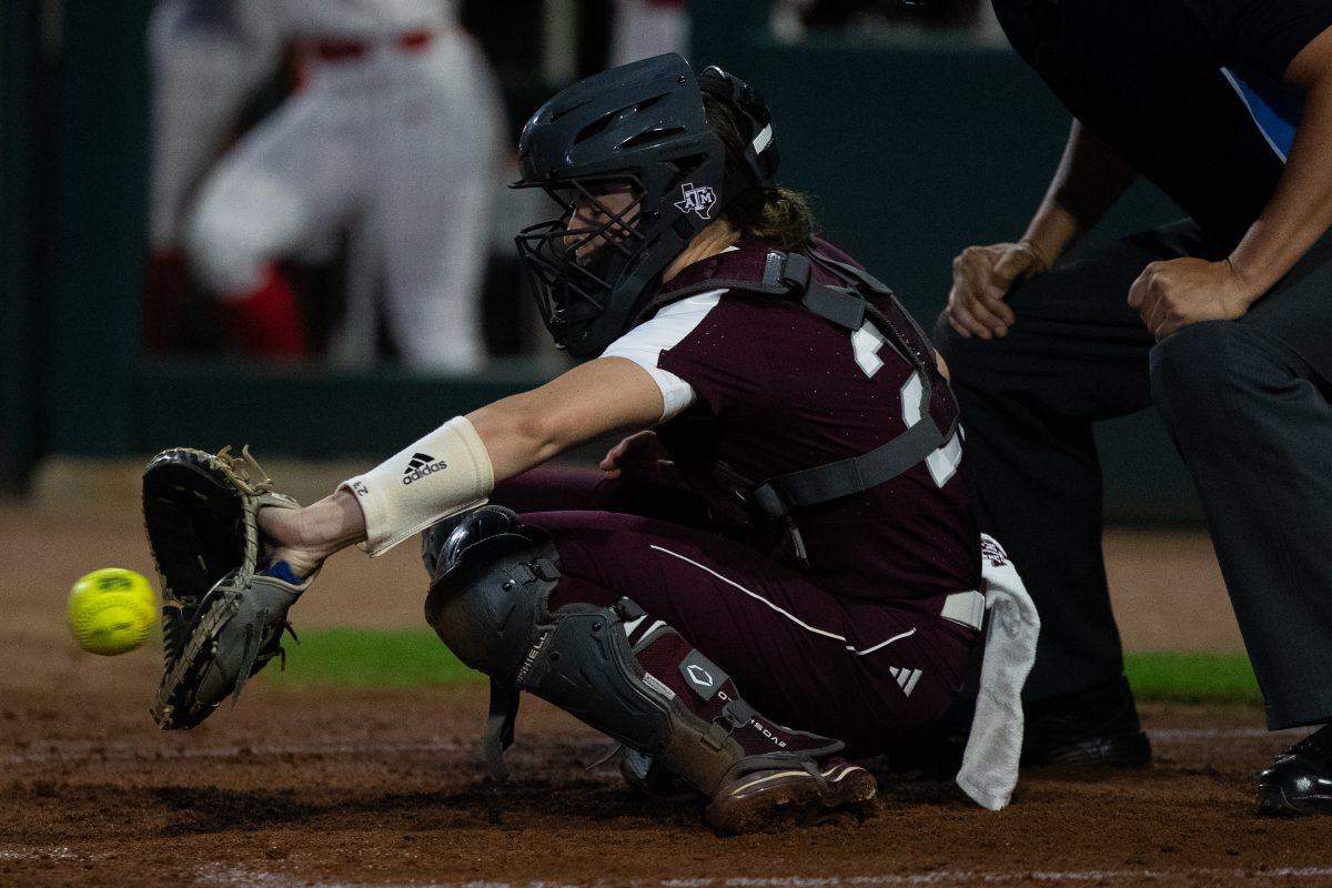 Freshman C Riley Valentine (27) catches the softball at Davis Diamond on Wednesday, March. 1, 2023