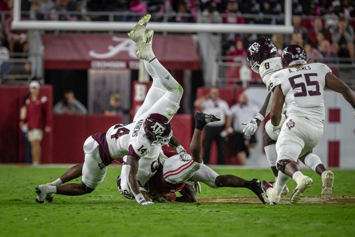 Freshman DB Jacoby Matthews (14) stops an Alabama run during Texas A&Ms game against the Alabama Crimson Tide on Saturday, Oct. 8, 2022, at Bryant-Denny Stadium in Tuscaloosa, Alabama.