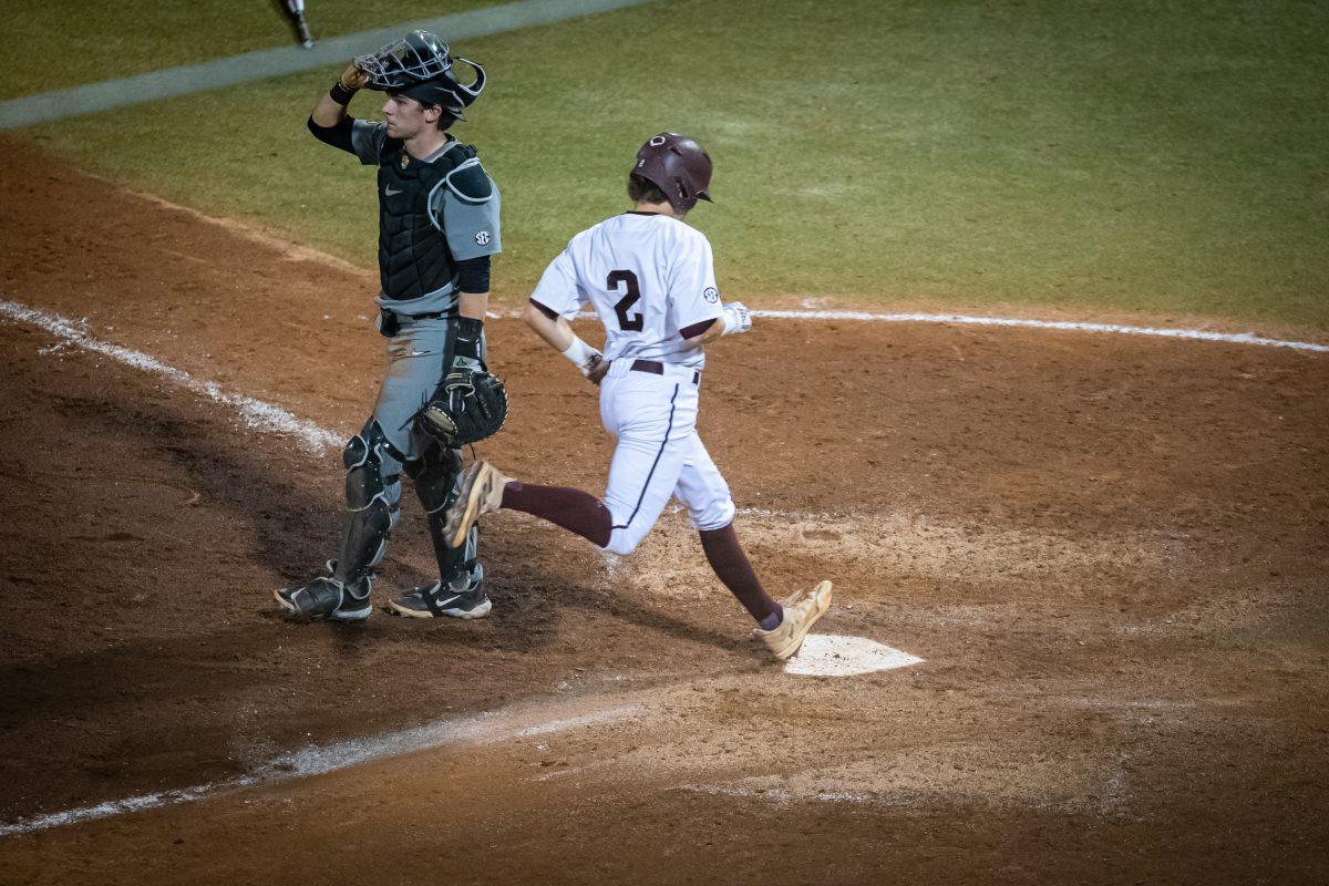 Junior SS Hunter Haas (2) crosses home plate to score during Texas A&amp;M's game against Mizzou at Olsen Field on Thursday, April 13, 2023.