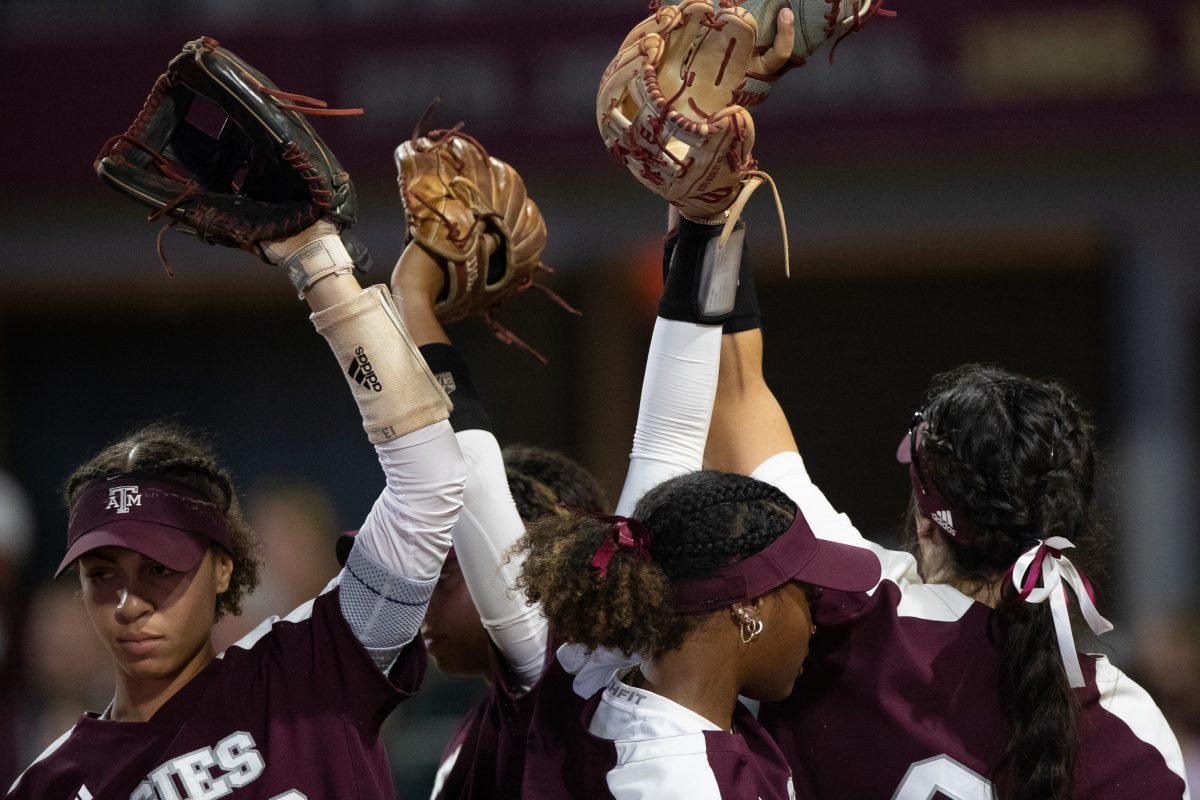 Aggie softball players break out before a new inning startsat Davis Diamond on Wednesday, March. 1, 2023