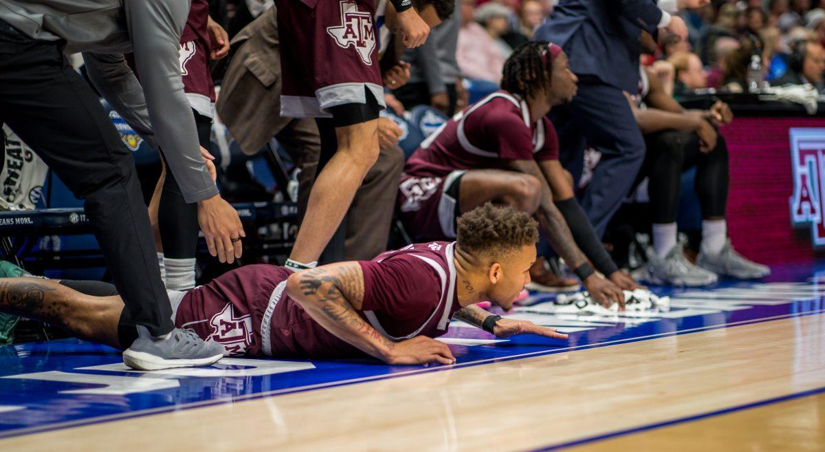 Graduate G Dexter Dennis (0) on the floor supporting the team during a game vs. Alabama on March 12, 2023 at Bridgestone Arena in Nashville Tennessee.