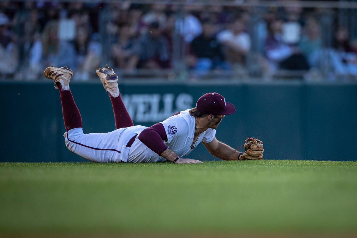 Junior 3B Trevor Werner (28) dives for a ground ball during Texas A&Ms game against Texas at Olsen Field on Tuesday, March 28, 2023.