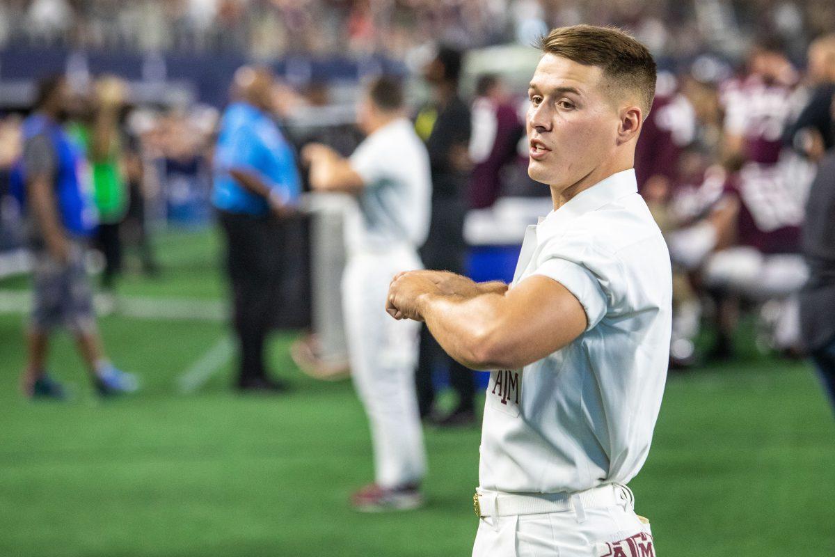 Junior construction science junior and Yell Leader Trevor Yelton helps lead the War Hymn during the Southwest Classic on Saturday, Sept. 24, 2022, at AT&T Stadium in Arlington, Texas.