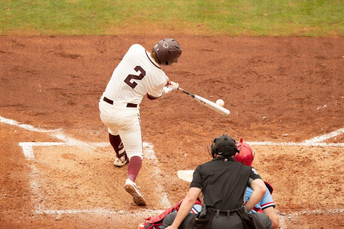 Junior INF Hunter Haas (2) hits a ground ball during Texas A&Ms game against Ole Miss at Olsen Field on Sunday, April 2, 2023.