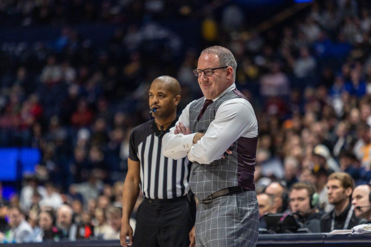 <p>Basketball coach Buzz Williams smiles from the sidelines during a game against Vanderbilt on March 11, 2023, at Bridgestone Arena in Nashville, Tenn.</p>