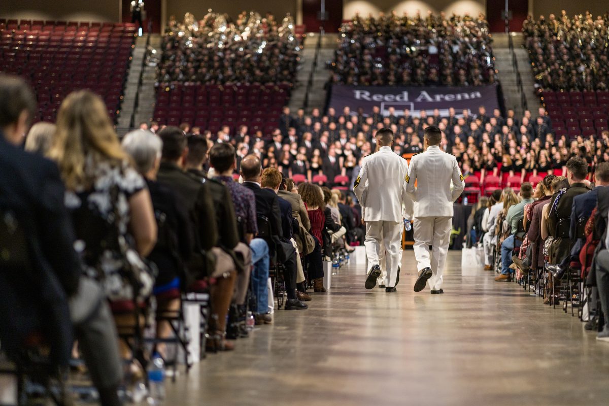 The Ross Volunteers take a seat before the ceremony on Friday, April 21, 2023 at Reed Arena.