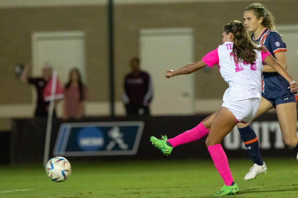 Sophomore M Carissa Boeckmann (14) kicks the ball during Texas A&amp;M's match against Auburn at Ellis Field on Friday, Oct.14, 2022.