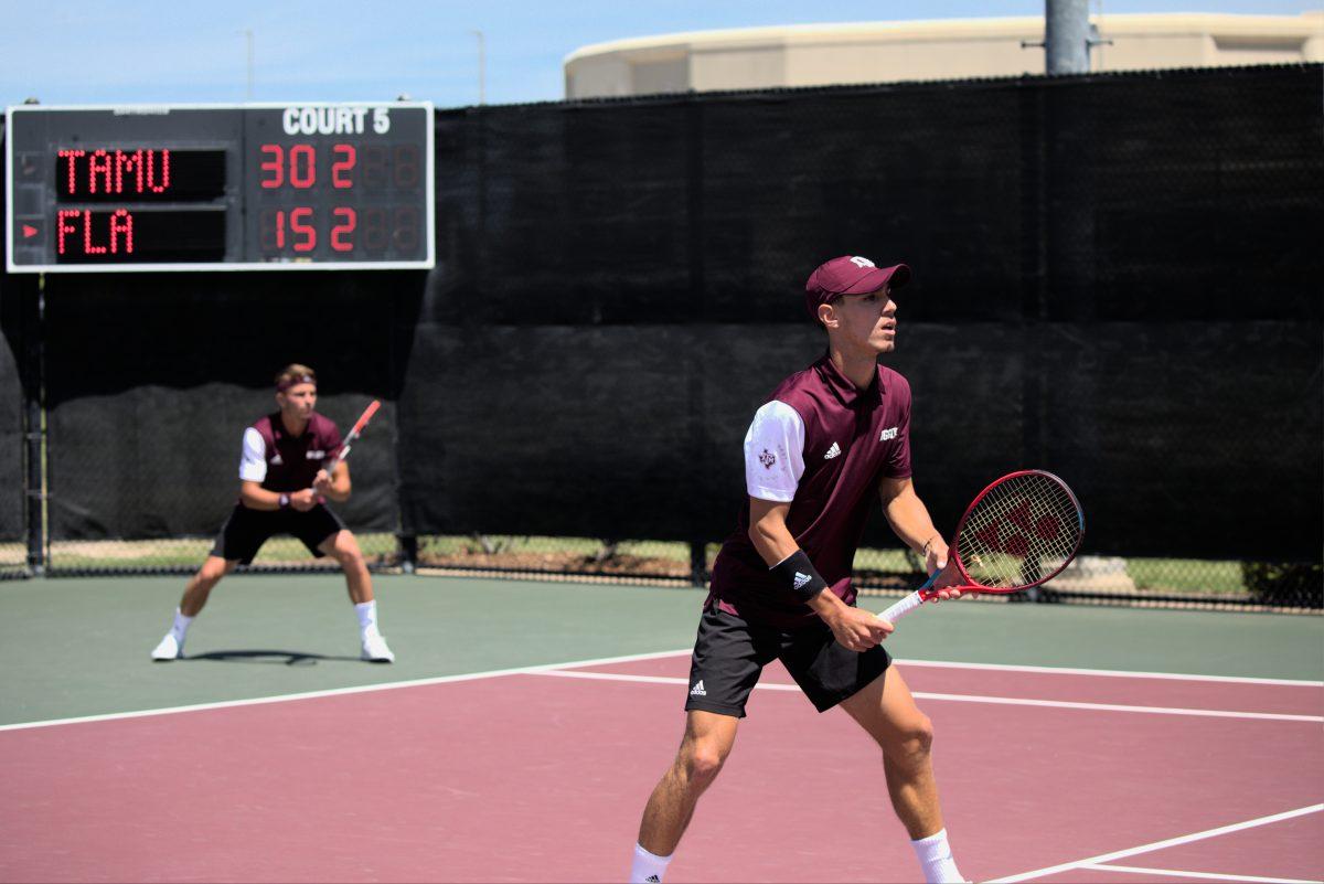Sophomore Giulio Perego (front right), and Junior Raphael Perot (back left) get ready to start their doubles match at the Mitchell Outdoor Tennis Center on April 1, 2023.