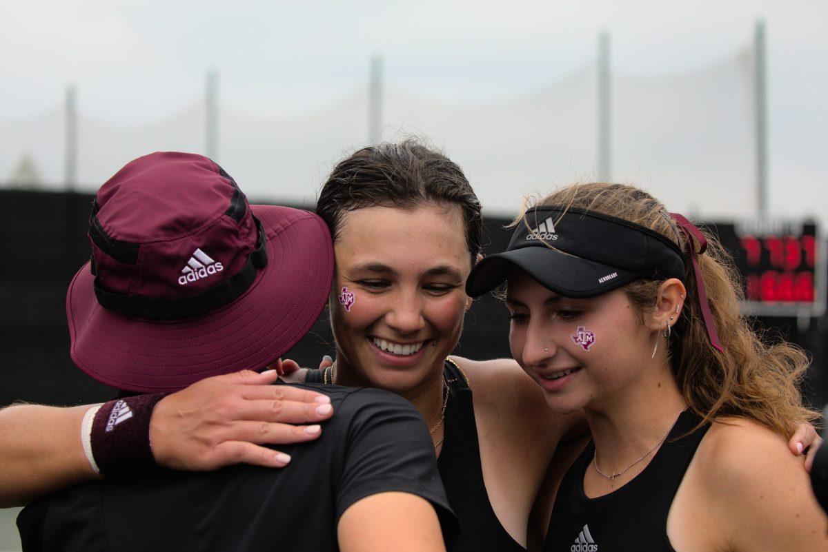 <p>Sophomore Mia Kupres (center) celebrates the win against Georgia with her teammates at the Mitchell Outdoor Tennis Center on April 2, 2023.</p>