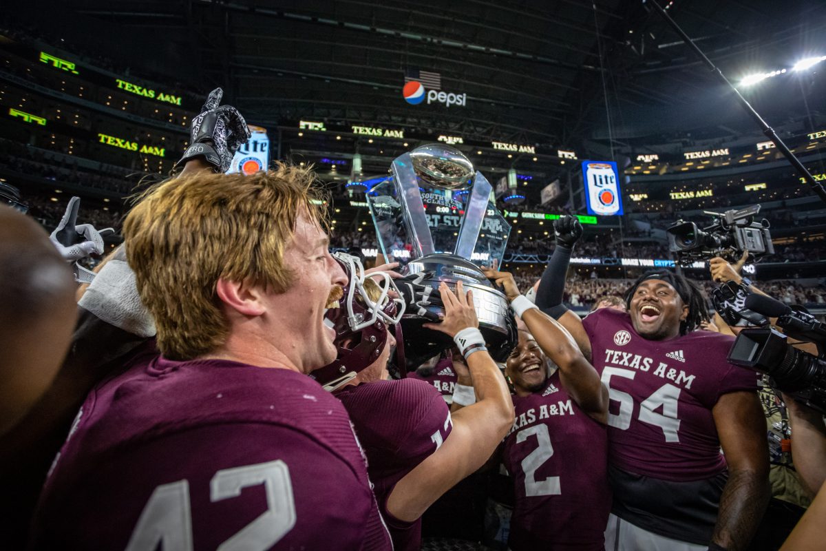 The Aggies raise the Southwest Classic Trophy after defeating Arkansas 23-21 on Saturday, Sept. 24, 2022, at AT&amp;T Stadium in Arlington, Texas.