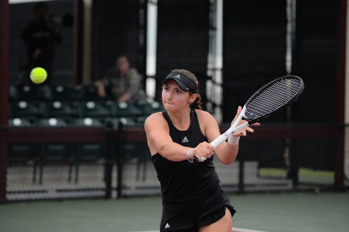 Sophomore Mary Stoiana keeps her eyes on the ball at the Mitchell Outdoor Tennis Center on April 2, 2023.