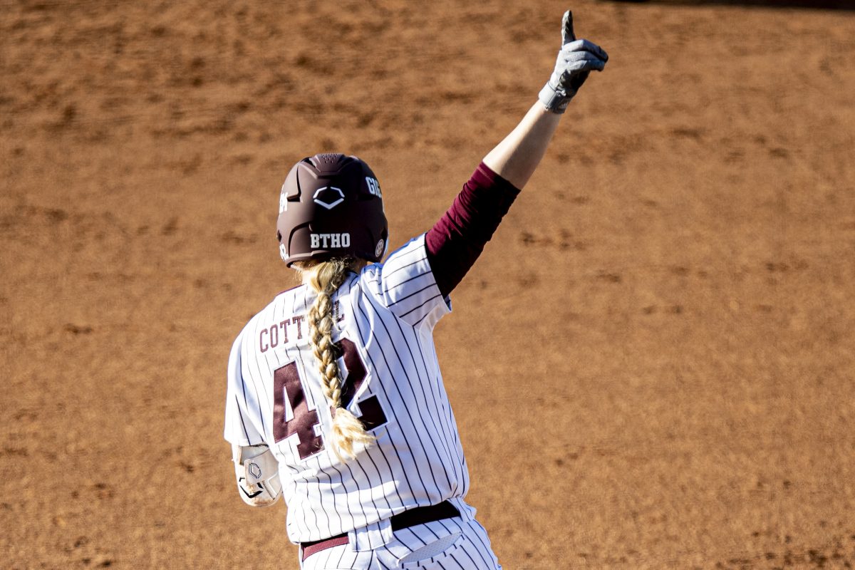 <p>Junior DP Julia Cottrill (42) points a finger up after hitting a homer during Texas A&M's game against Mizzou at Davis Diamond on Sunday, April 30, 2023.</p>