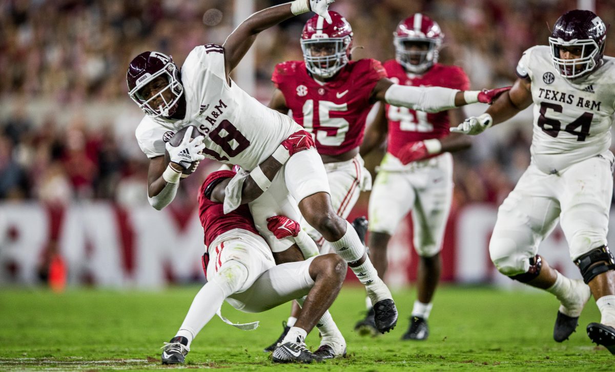 Freshman TE Donovan Green (18) is brought down by Alabama defense during a game against the Alabama Crimson Tide on Saturday, Oct. 8, 2022, at Bryant-Denny Stadium in Tuscaloosa, Alabama.