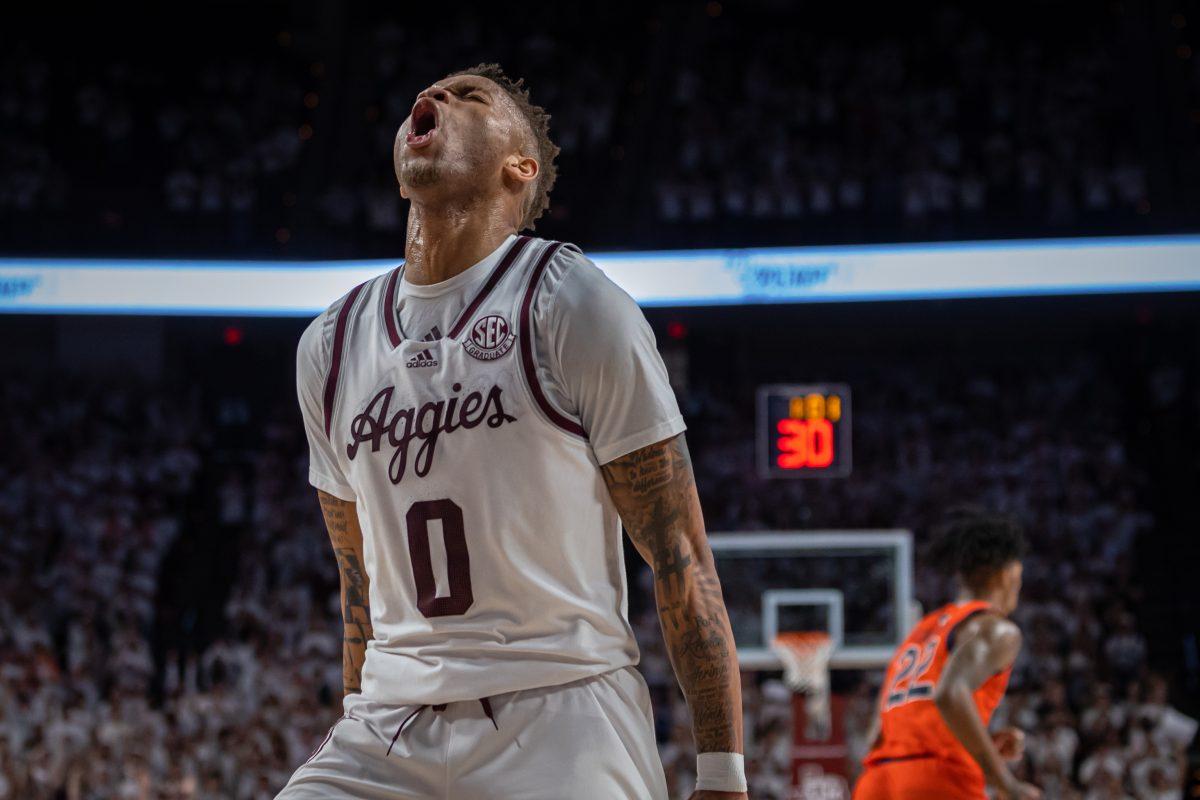 <p>Graduate G Dexter Dennis (0) celebrates after scoring during Texas A&M's game against Auburn at Reed Arena on Tuesday, Feb. 7, 2022.</p>