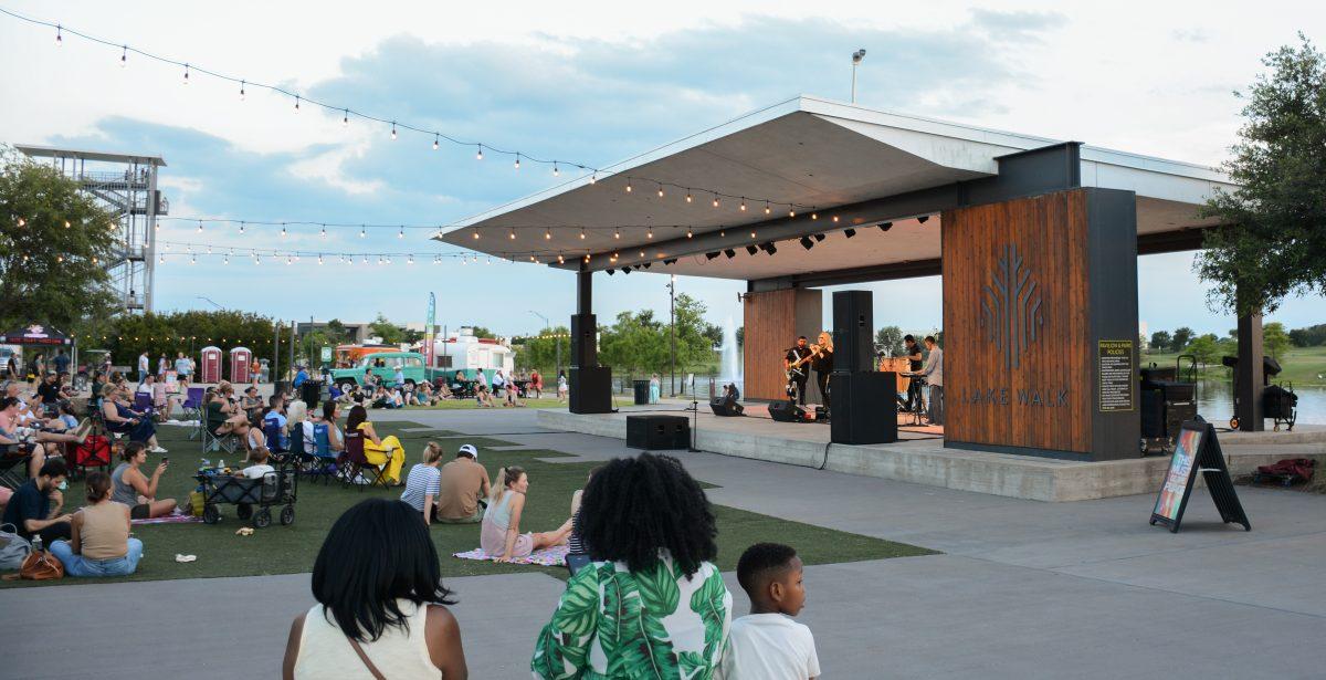 Guests enjoy the live performance by the Leslie Lugo Band during the Eats & Beats summer concert series at Lake Walk in Bryan, Texas on Saturday, June 3, 2023.