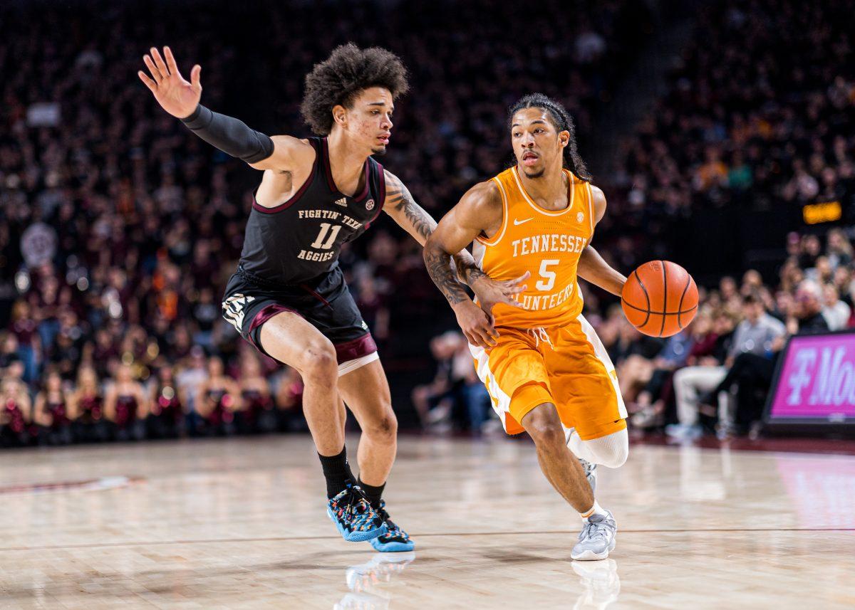 Junior F Andersson Garcia (11) blocks Tennessee G Zakai Zeigler (5) during a game vs. Tennessee at Reed Arena on Tuesday, Feb. 21, 2023.