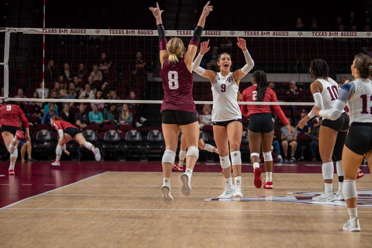 The Aggies celebrate a point as Alabama dives for the ball during A&Ms match against Alabama at Reed Arena on Wednesday, Nov. 2, 2022.