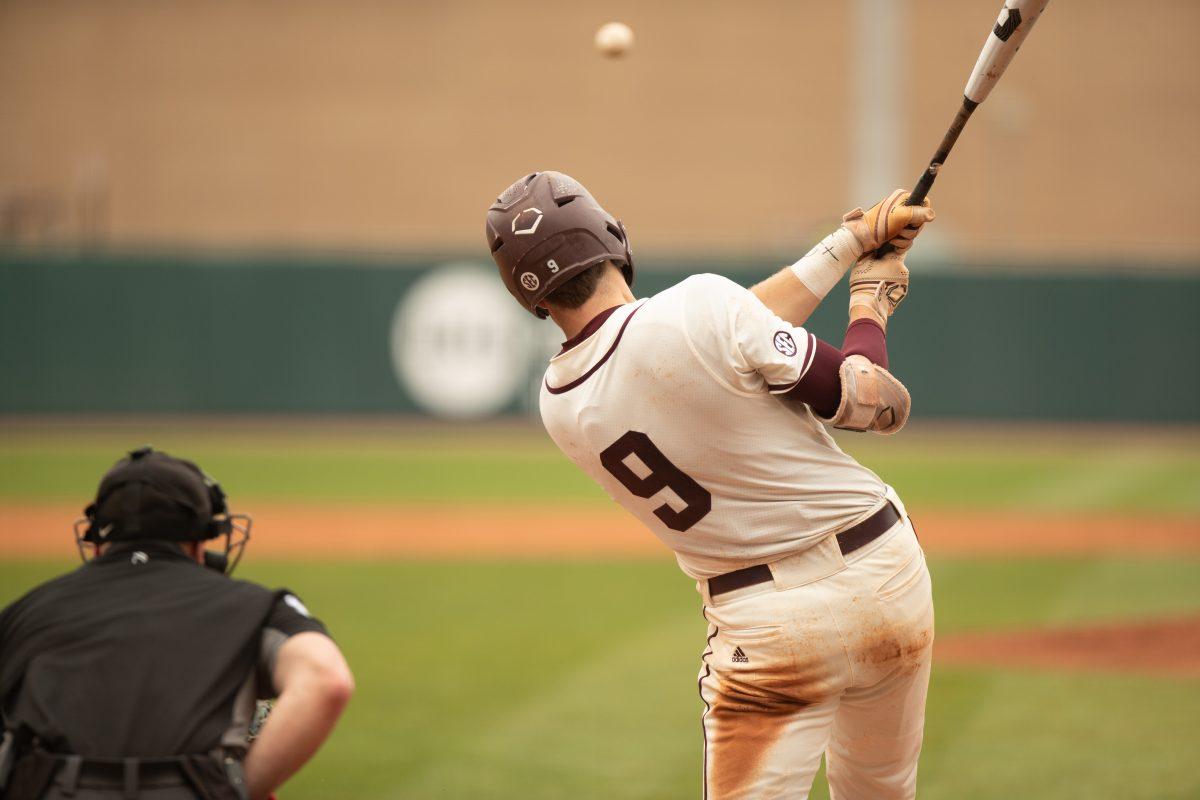 Junior INF Jack Moss (8) hits a single to left field during Texas A&Ms game against Ole Miss at Olsen Field on Sunday, April 2, 2023.