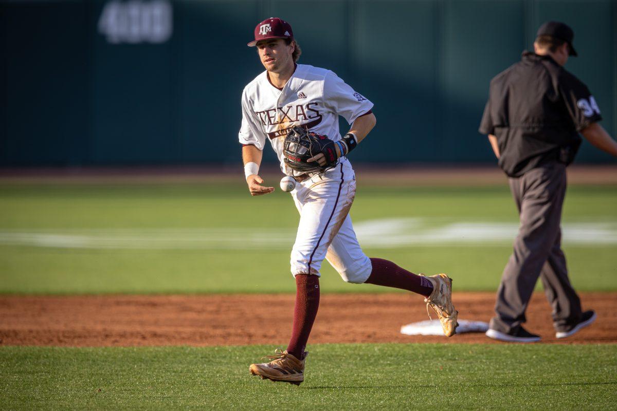 Junior SS Hunter Haas (2) returns the ball to the mound after getting the third out in the top of the second inning during Texas A&Ms game against Texas at Olsen Field on Tuesday, March 28, 2023.