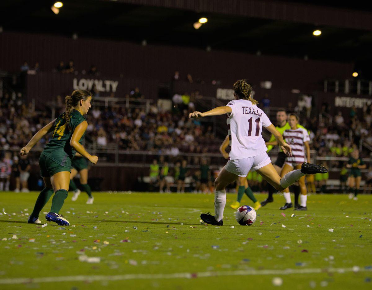 Senior Forward Sammy Smith (11) shoots the ball at the Aggies match against Baylor at Ellis Field on Saturday, Aug. 26, 2023.