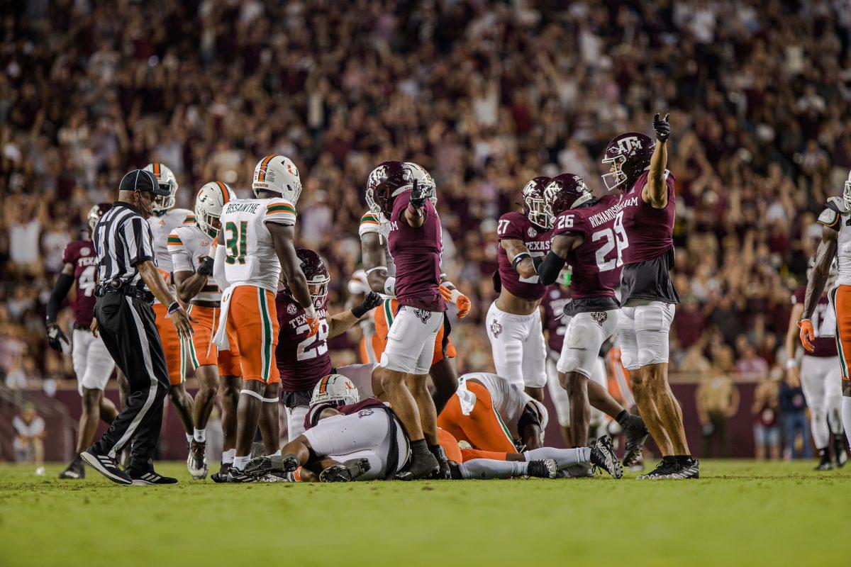 The Texas A&amp;M players point to the A&amp;M end zone after a loose ball was recovered by the Aggies during Texas A&amp;M's game against Miami at Kyle Field on Saturday, Sept. 17, 2022.