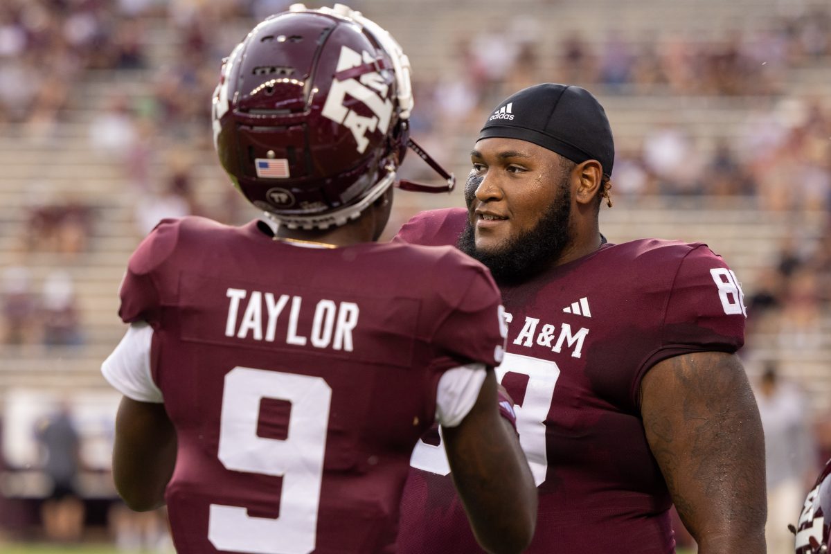 <p>Freshman DL Samu Taumanupepe (88) talks with redshirt freshman DB Bobby Taylor (9) before the start of Texas A&M's football game against ULM at Kyle Field on Saturday, Sept. 16, 2023.</p>