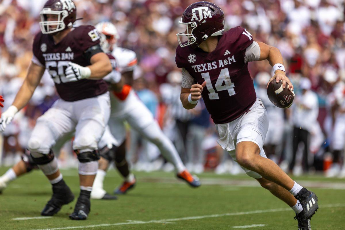 <p>Sophomore QB Max Johnson (14) scrambles outside of the pocket during Texas A&M's game against Auburn on Saturday, Sept. 23, 2023 at Kyle Field. (CJ Smith/The Battalion)</p>