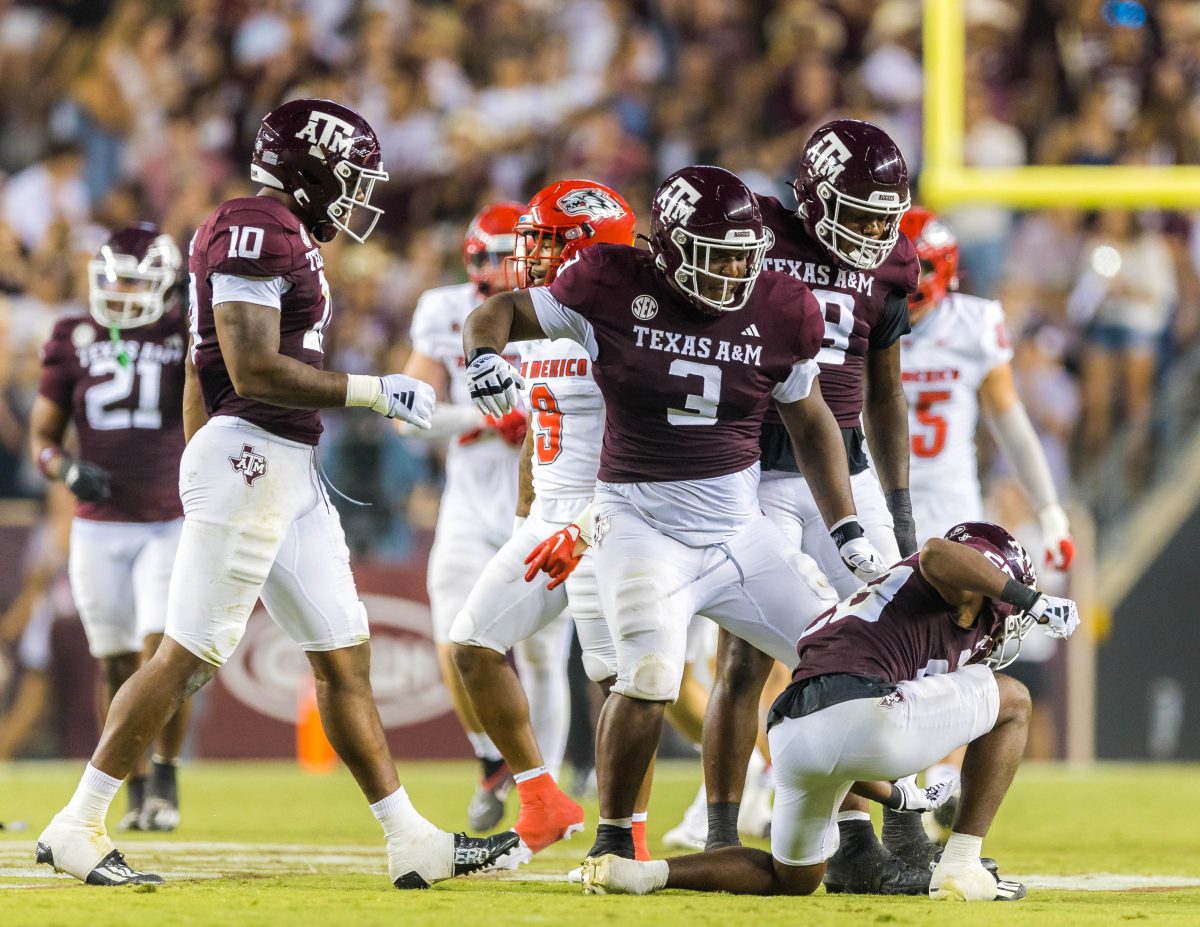Texas A&M DL McKinnley Jackson (3), DB Josh DeBerry, DL Fadil Diggs (10) celebrae stopping the ball during a game vs. New Mexico on Saturday, Sept. 2, 2023 at Kyle Field.