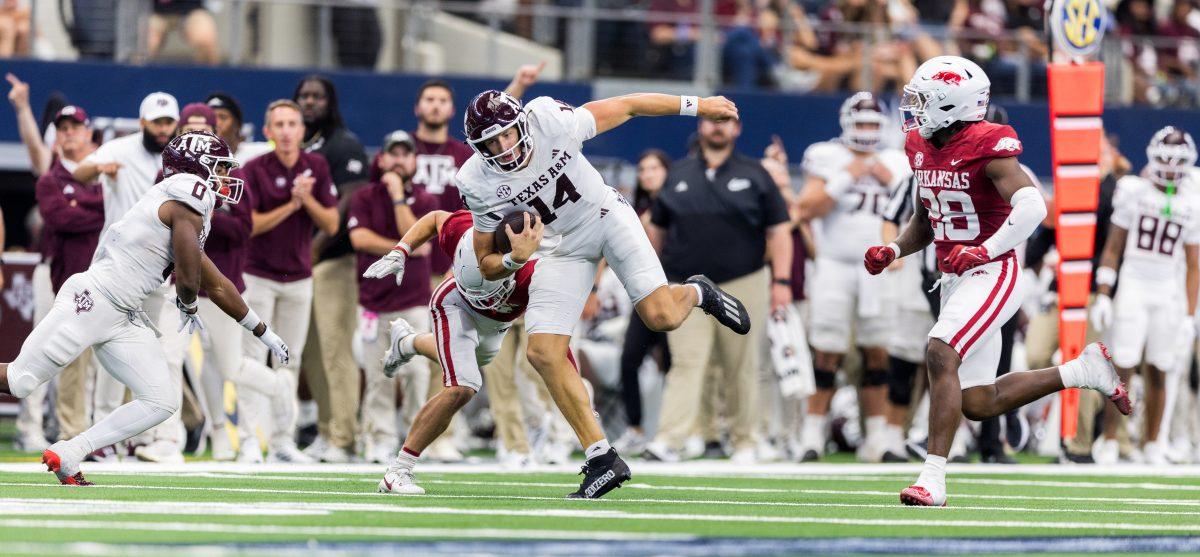 Sophomore QB Max Johnson (14) rushes for a gain of 32 yards during the Southwest Classic against Arkansas on Saturday, Sept. 30, 2023. (Ishika Samant/The Battalion)