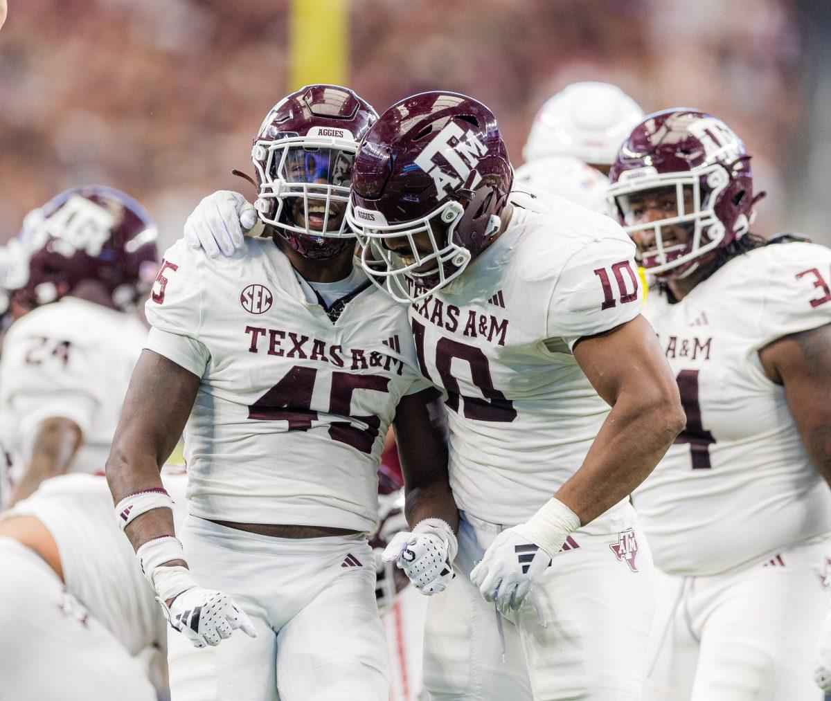<p>Junior LB Edgerrin Cooper (45) and junior DL Fadil Diggs (10) celebrate after a third down stop during the Southwest Classic against Arkansas on Saturday, Sept. 30, 2023. (Ishika Samant/The Battalion)</p>