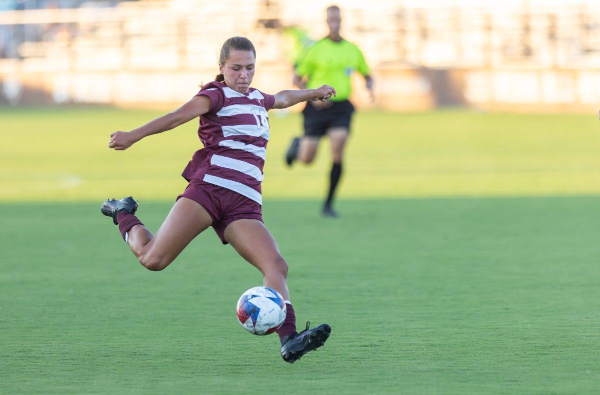 Junior M Carissa Boeckmann (14) strikes the ball for a shot on goal during Texas A&Ms game against Grambling State on Thursday, Sept. 7, 2023 at Ellis Field. (CJ Smith/The Battalion)