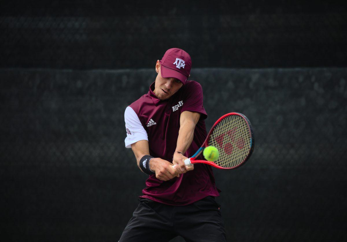 Sophomore Giulio Perego hits the ball at the Mitchell Outdoor Tennis Center on April 1, 2023.