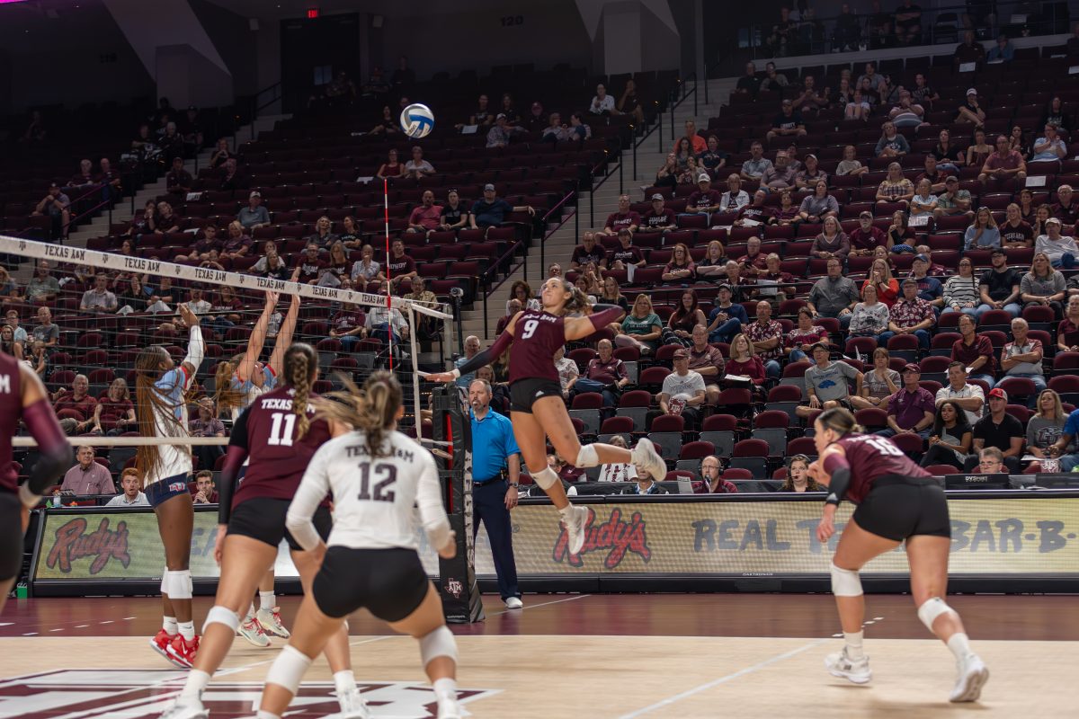 Sophomore+OPP+Logan+Lednicky+%289%29+jumps+up+to+spike+the+ball+during+Texas+A%26amp%3BMs+game+against+Liberty+on+Friday%2C+Sept.+15%2C+2023+at+Reed+Arena.+%28CJ+Smith%2FThe+Battalion%29
