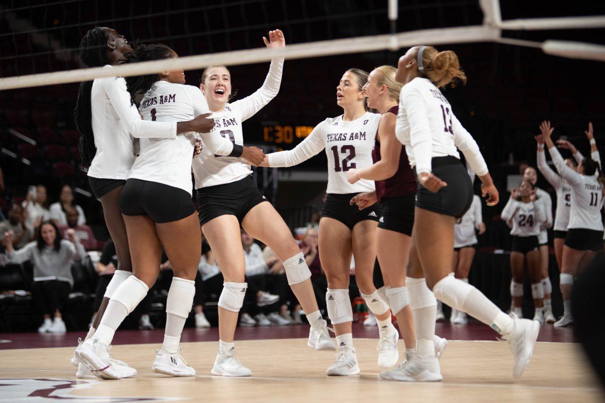 The volleyball team celebrates after scoring a point in Texas A&Ms game against Utah State on Thursday, Sept. 7, 2023 at Reed Arena. (Julianne Shivers/ The Battalion)