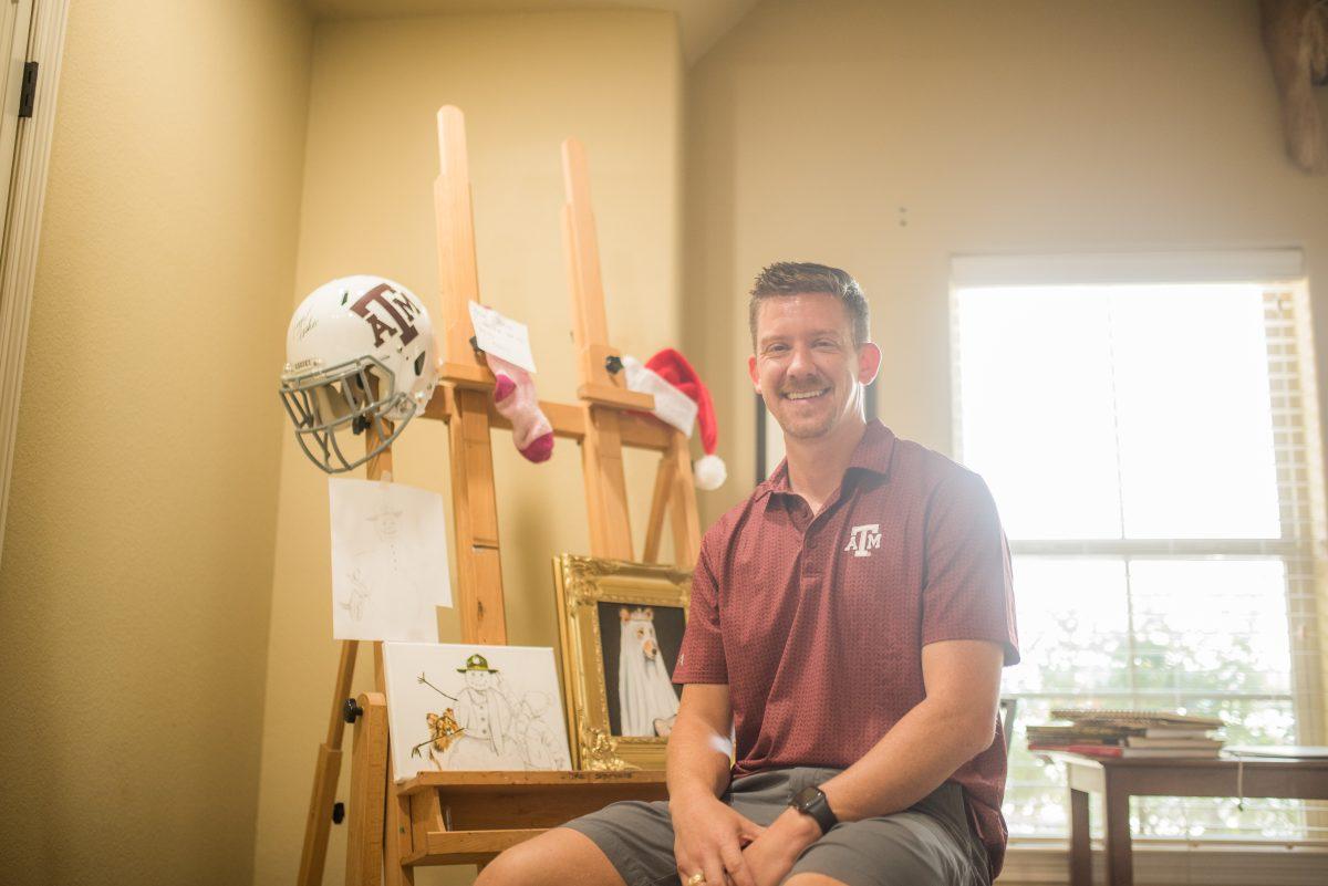 Trey Stephens sits in his studio, which was his former guest room. Stephens, who specializes in Aggie art, had paintings of Reveille and Santa in progress for Christmas.